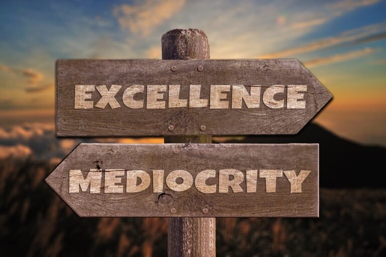 Signpost pointing to excellence and mediocrity, the choice behind habits that keep you mediocre at work