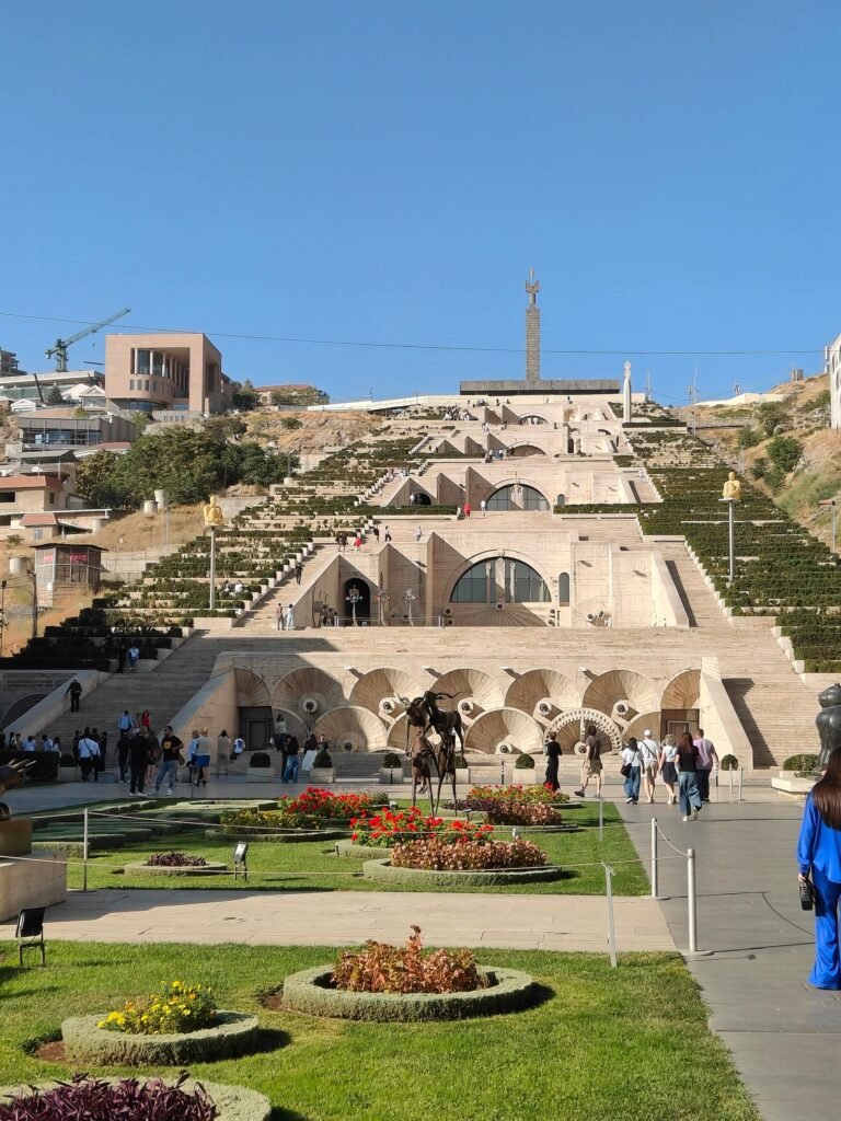 The Cascade in Yerevan, a wide staircase of terraces with fountains and sculptures, seen from the garden below